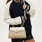 Coach Eliza Top Handle In Signature Canvas